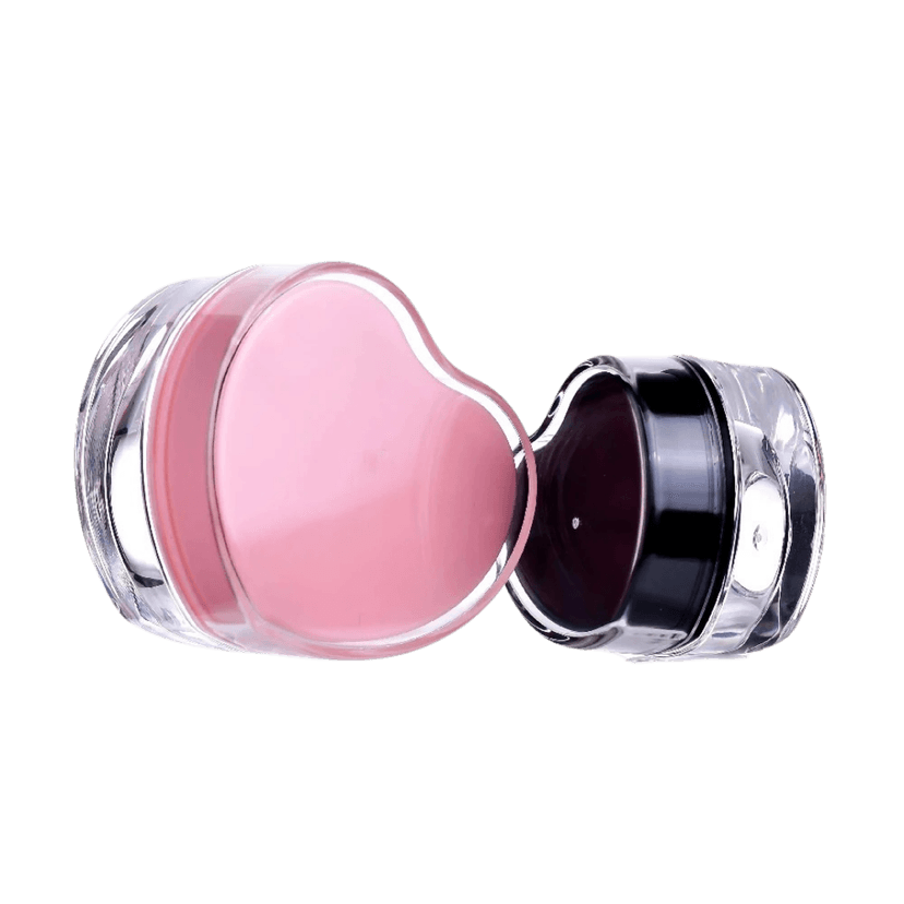 กระปุกครีมอะคริลิกทรงหัวใจ ฝาสีชมพู และฝาสีดำ ตัวกระปุกเป็นสีใส